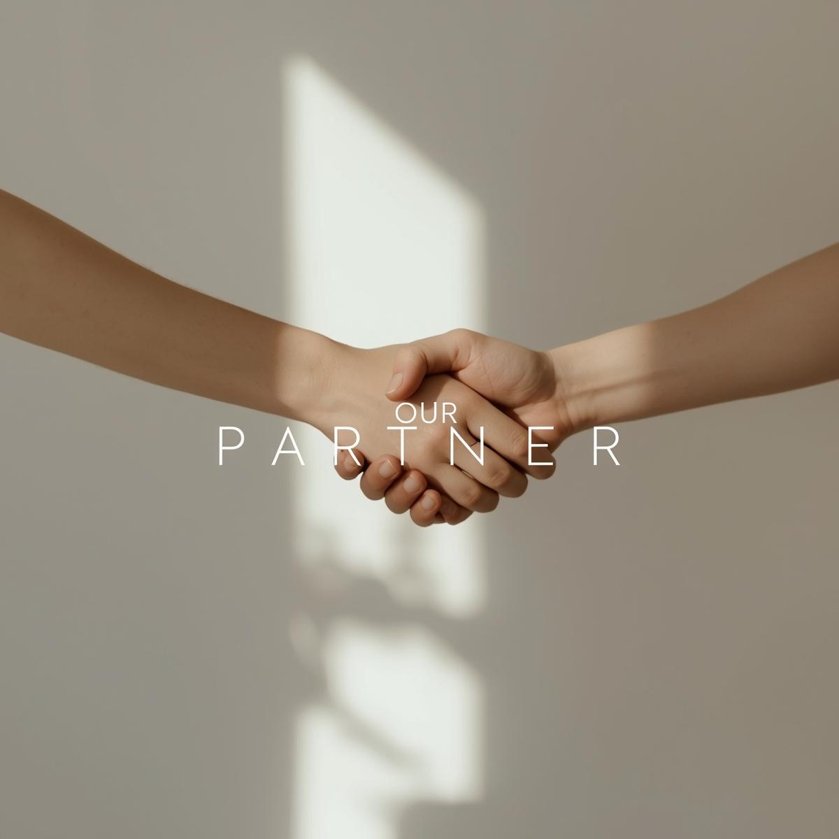Two hands holding each other with the text 'OUR PARTNER' on a neutral background